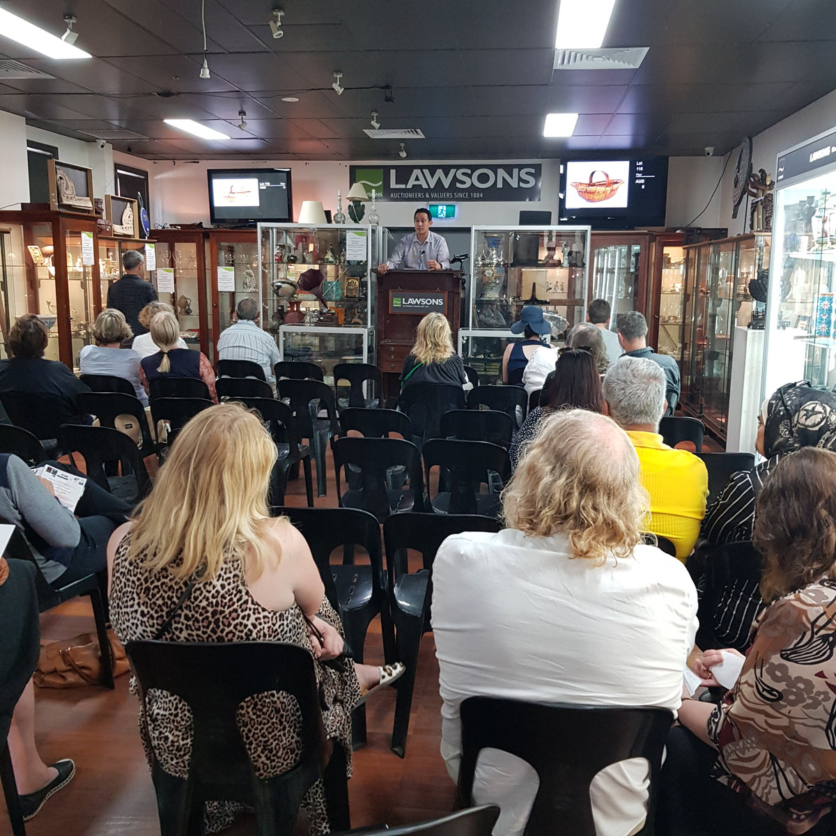 Having fun bidding at live auctions