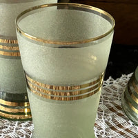 Frosted glass with gold stripes close